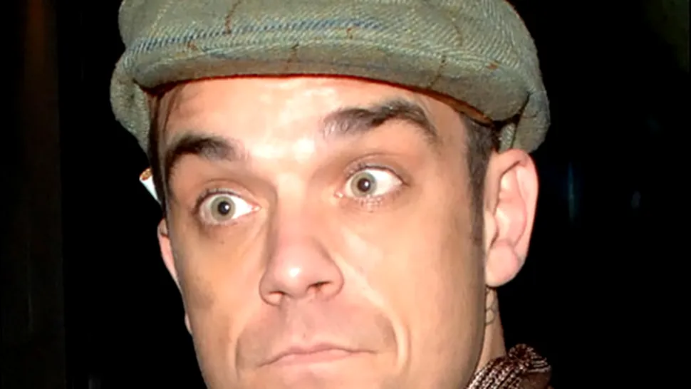 Robbie Williams a sarit dezbracat din balconul unui hotel