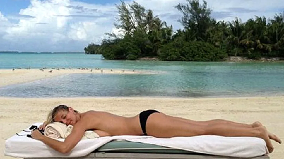 Heidi Klum, topless la plajă