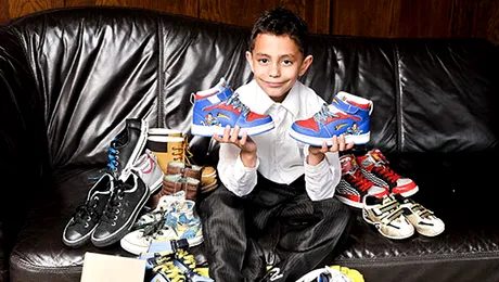 La 8 ani are numai haine de firmă, de 25.000 de euro