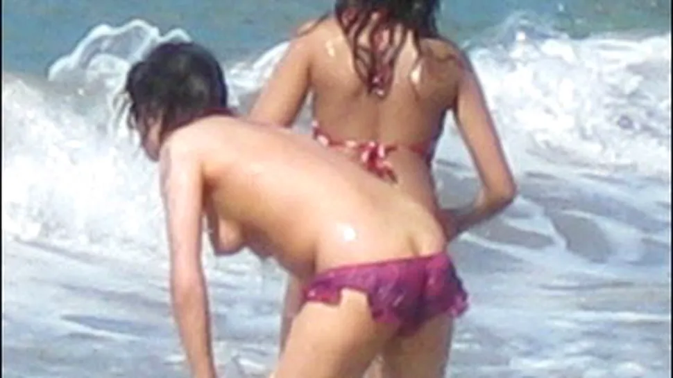 Amy Winehouse, fara sutien la plaja! (poze)